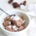 A bowl of chocolate ice cream sweetened with dates.