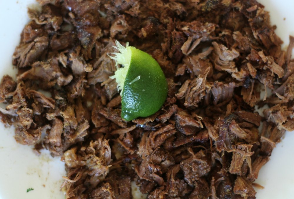 mexican hash brown shredded beef with lime on top