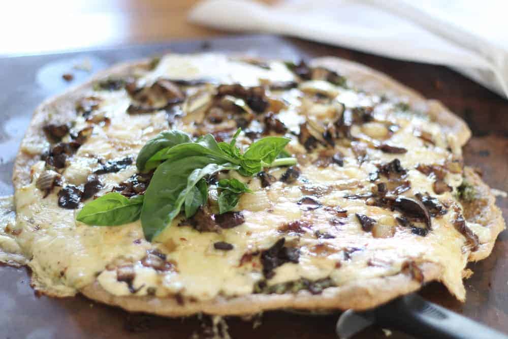 sourdough pizza with pesto and cream sauce