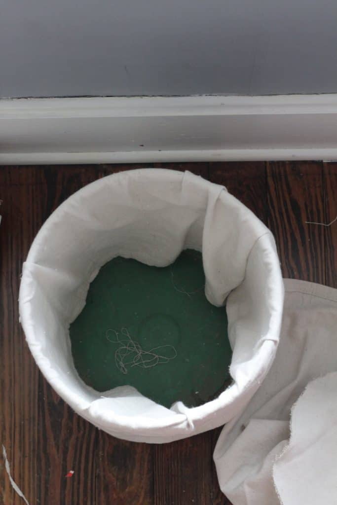 placing the fabric right side out inside and around the bucket