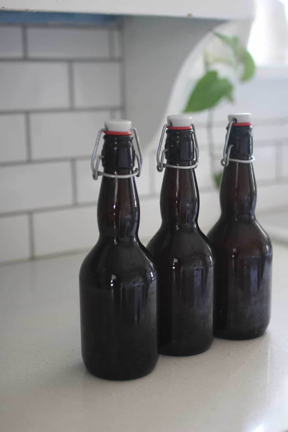 three amber bottles full of water kefit