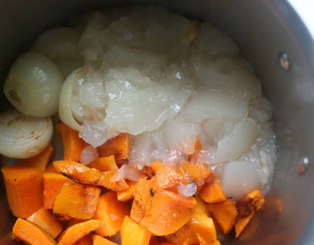 roasted veggies in a soup pot with gelled bone broth for roasted butternut squash soup