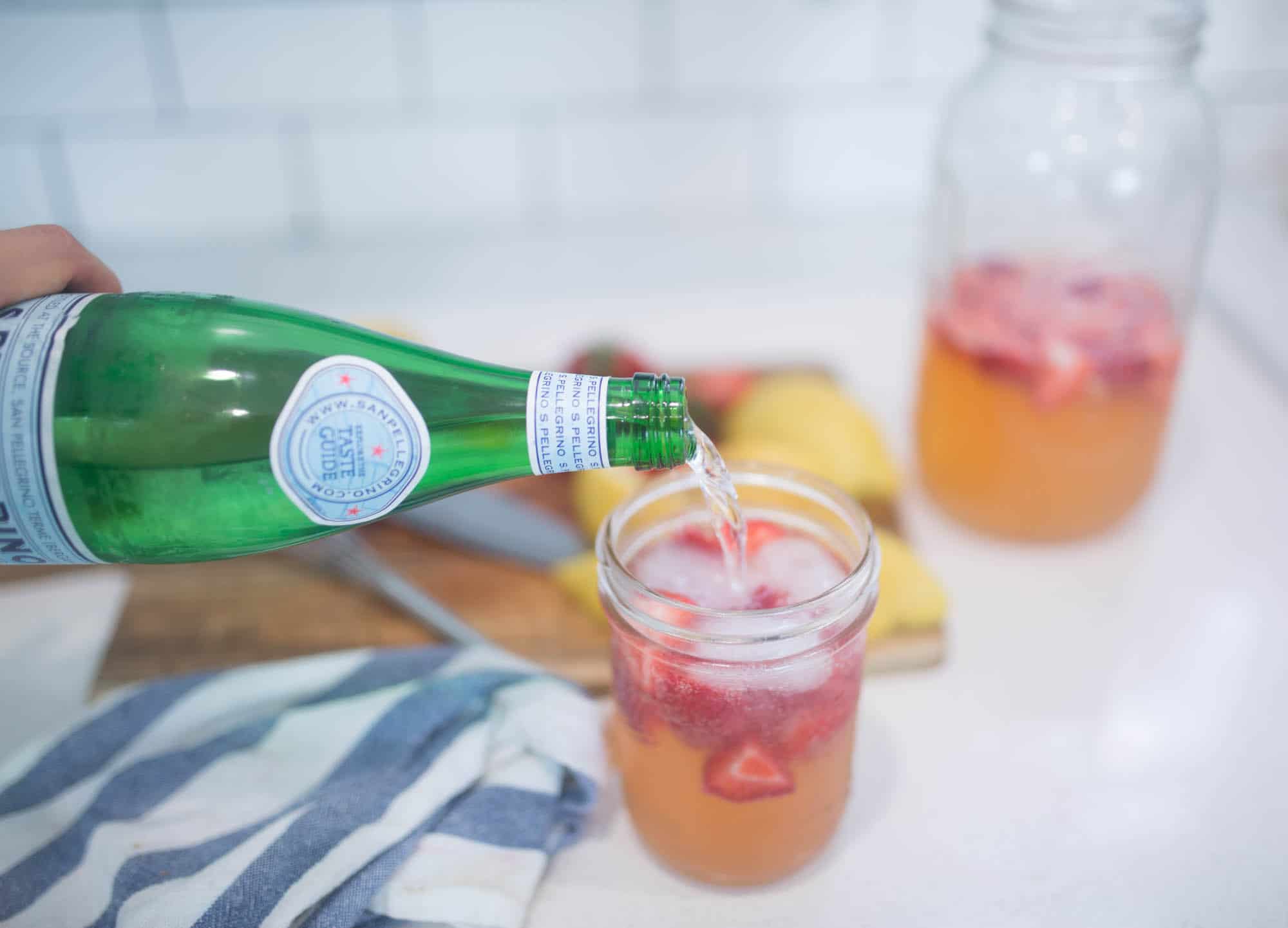 Learn how to make healthy homemade sparkling strawberry lemonade sweetened with honey 