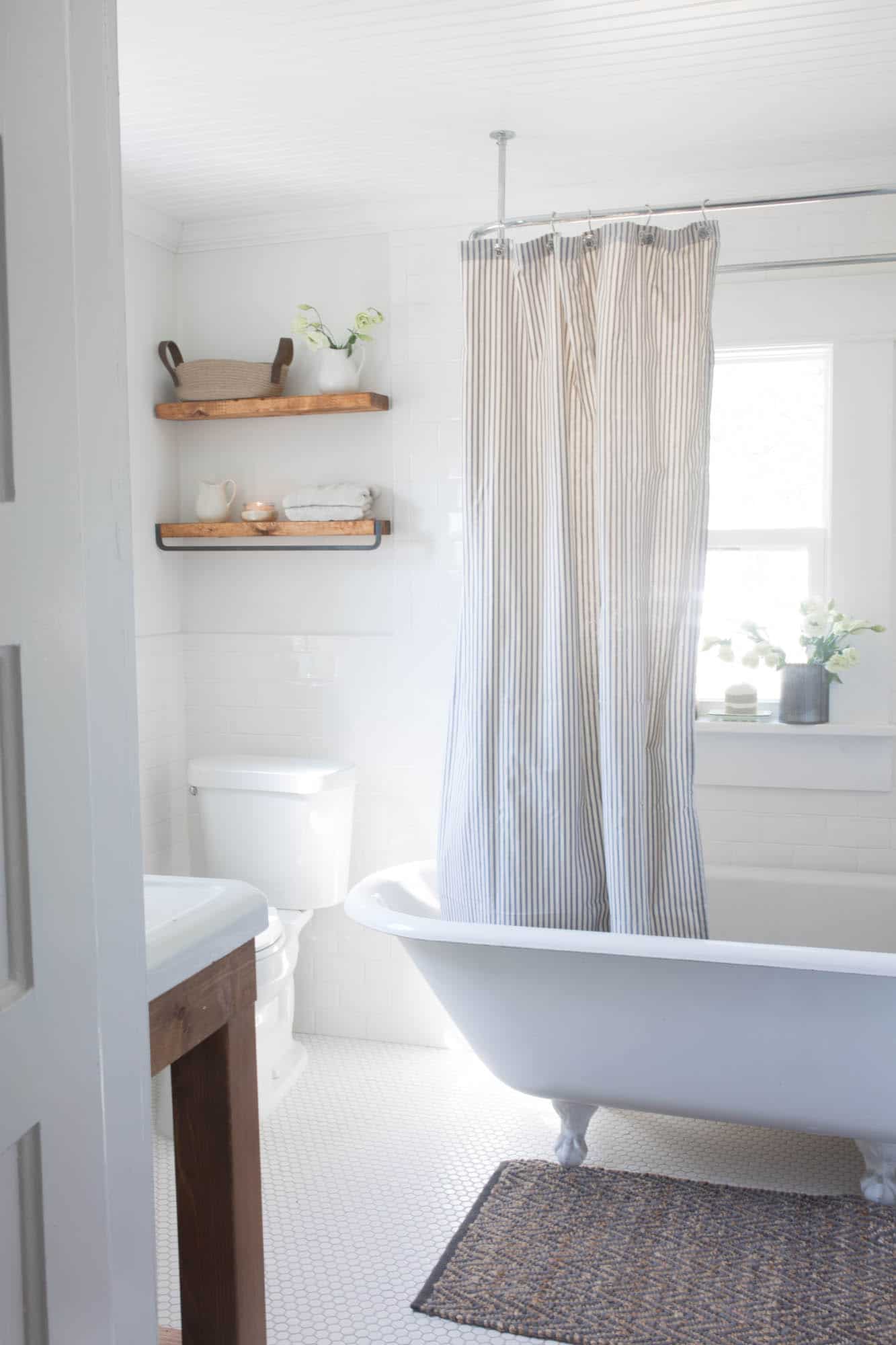 Farmhouse Bathroom Makeover Clawfoot Tub and Floating Shelves