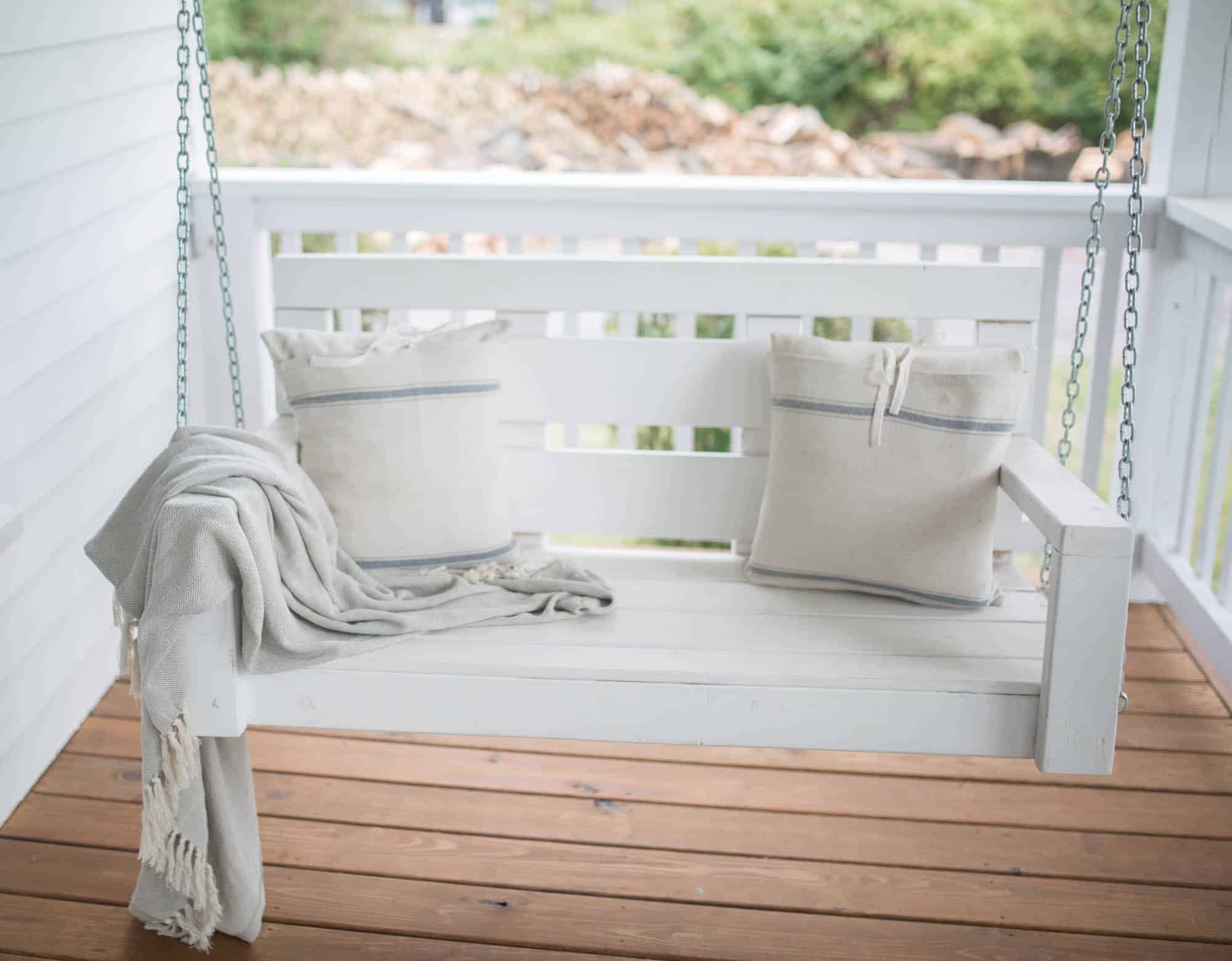 Fall Farmhouse Font Porch Swing with Grain Sack Pillows 