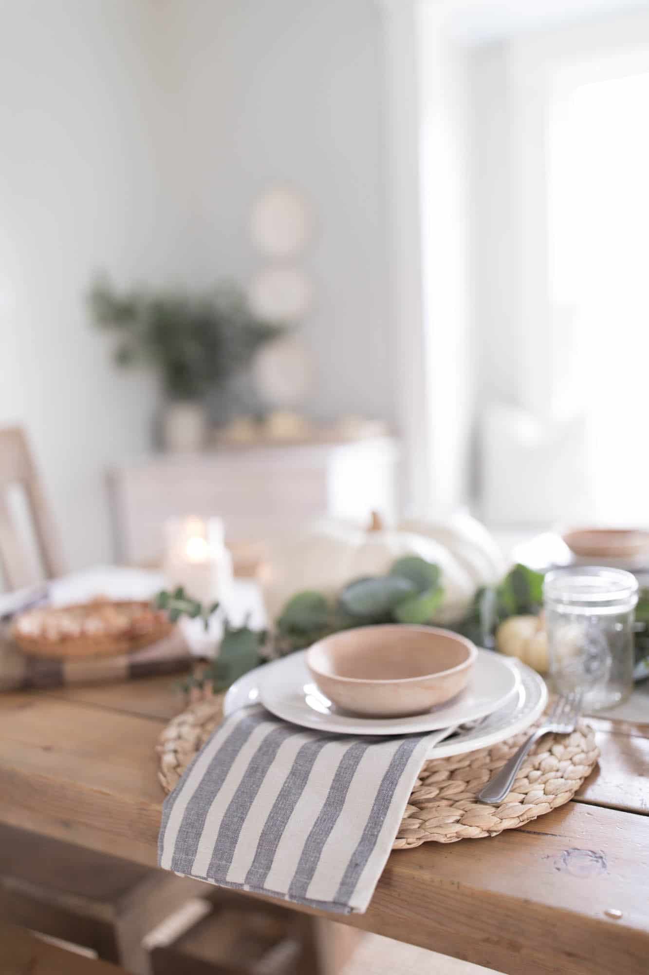 Thanksgiving Table Setting white and blue pumpkins and eucalyptus