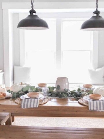 Farmhouse Thanksgiving Tablescape with pumpkins and eucalyptus