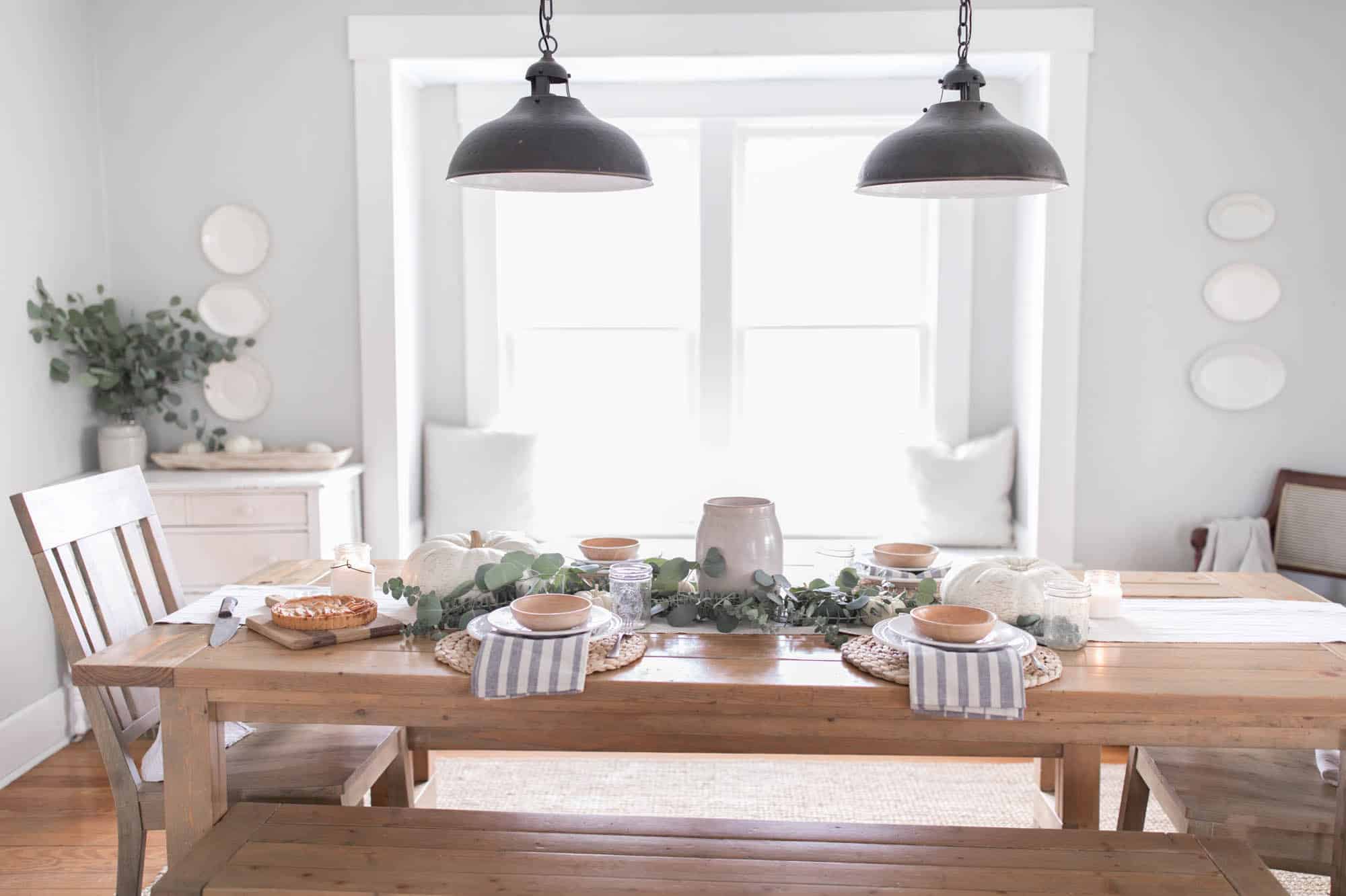 Farmhouse Thanksgiving Tablescape with pumpkins and eucalyptus