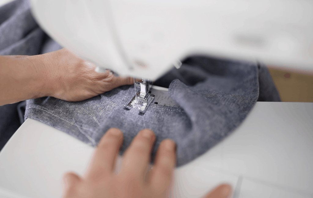 woman sewing apron