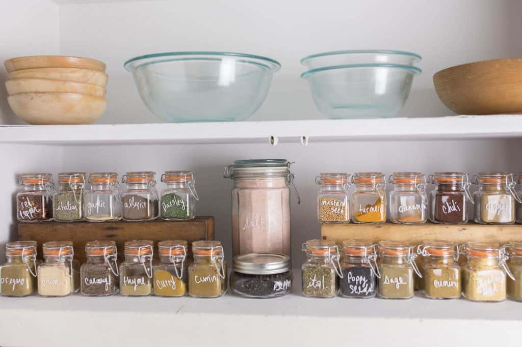 Spice Cabinet Organizing with glass jars and sharpie paint pen