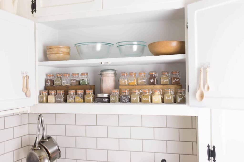 spice cabinet organization with glass spice jars