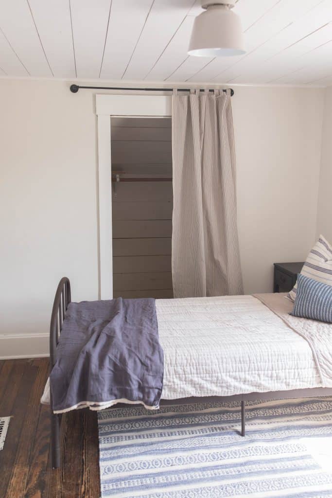 shiplap closet with a curtain ticking stripe