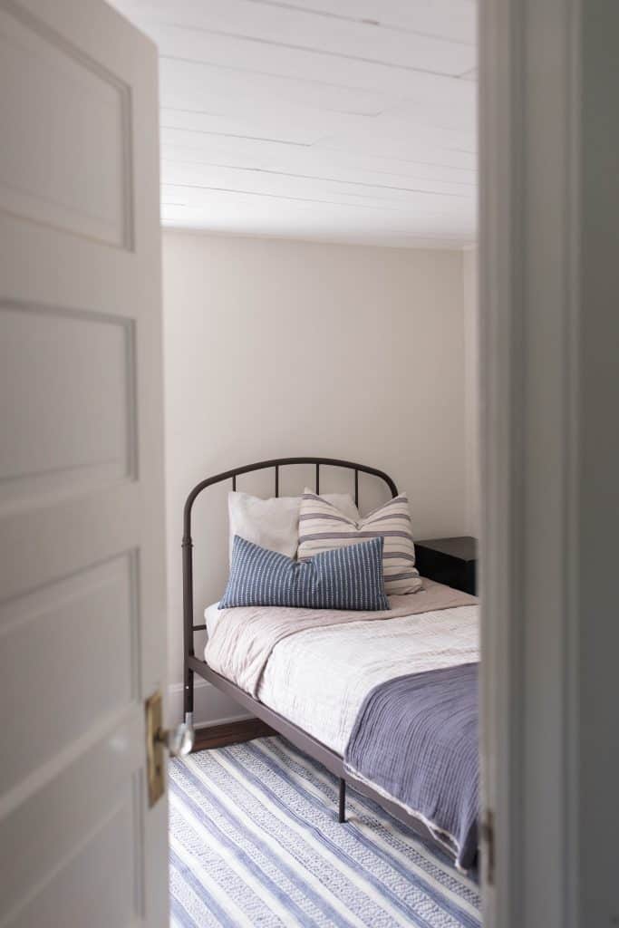 farmhouse boys room makeover ticking stripe iron beds