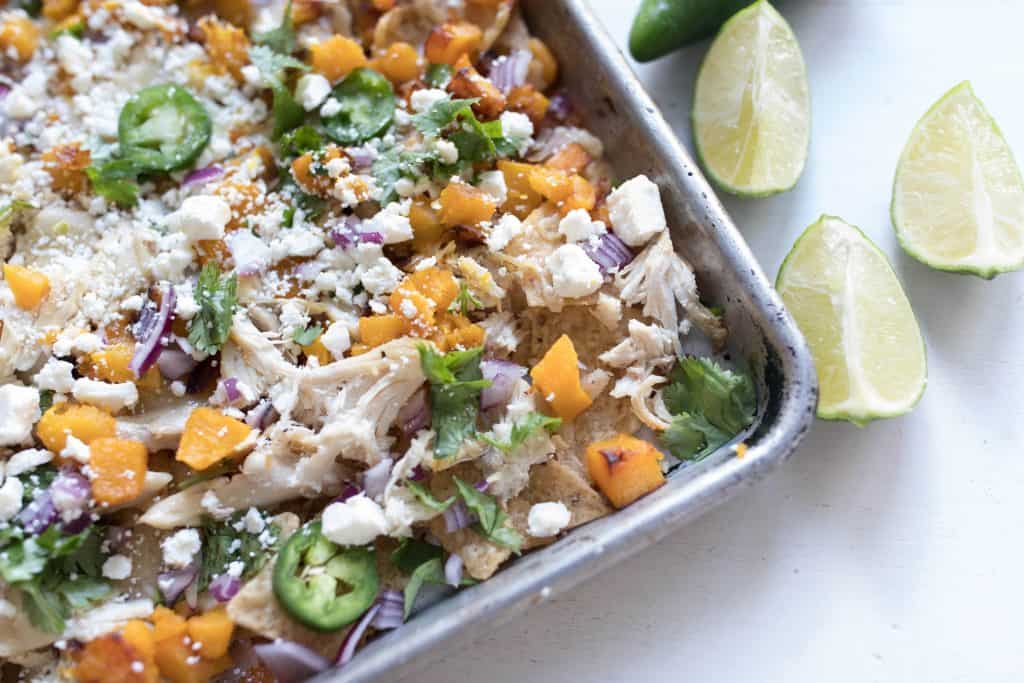 pumpkin sheet pan nachos with feta cheese and fresh jalapeno