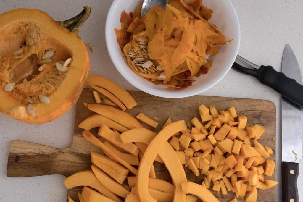 dicing a pie pumpkin for pumpkin sheet pan nachos