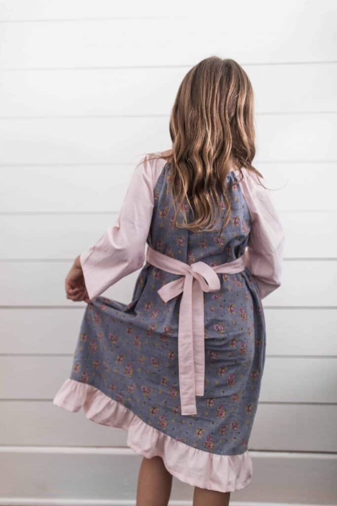 Girl wearing a homemade peasant dress for girls - peasant dress pattern sewing tutorial 