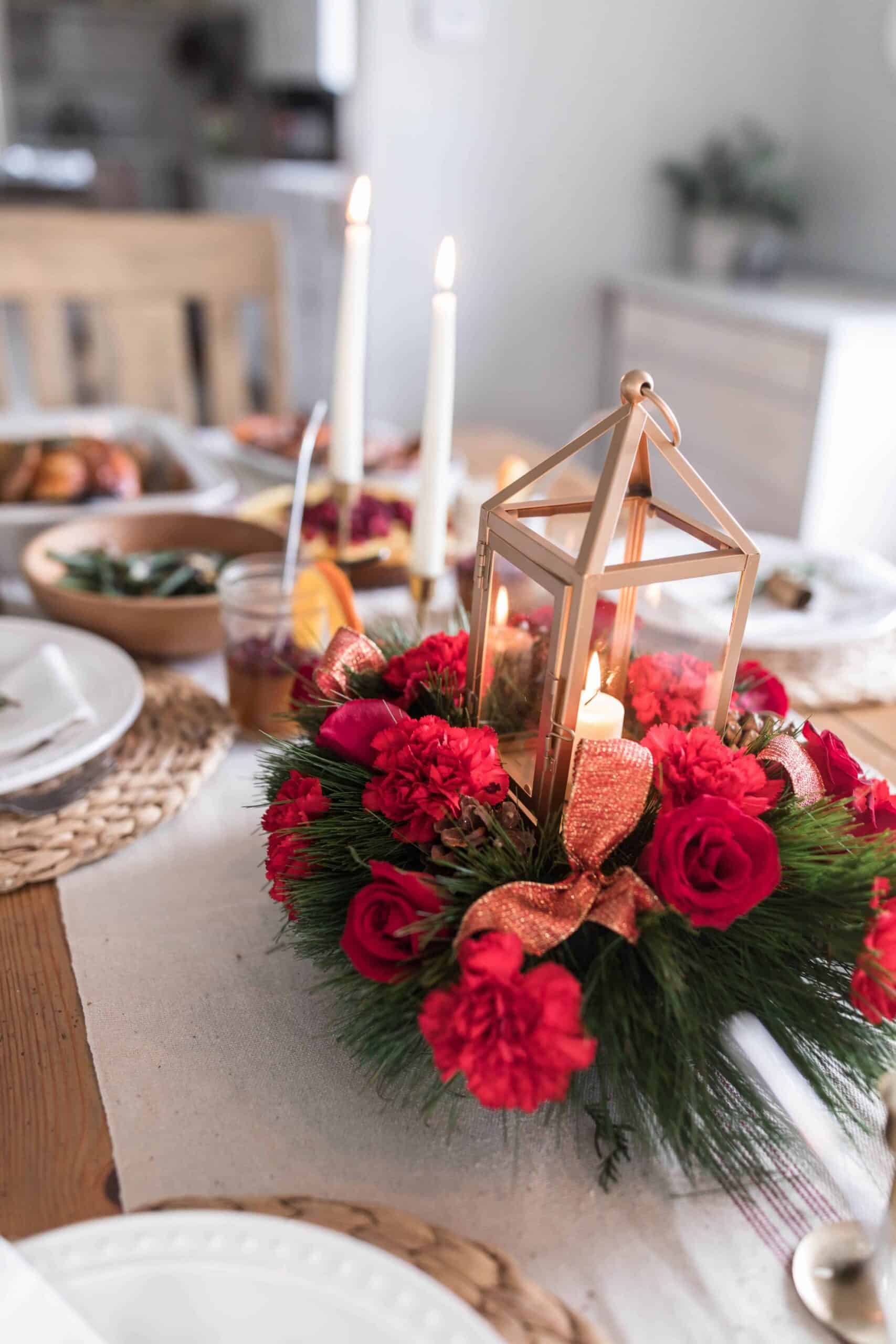 vibrant roses and rustic lantern Christmas centerpiece