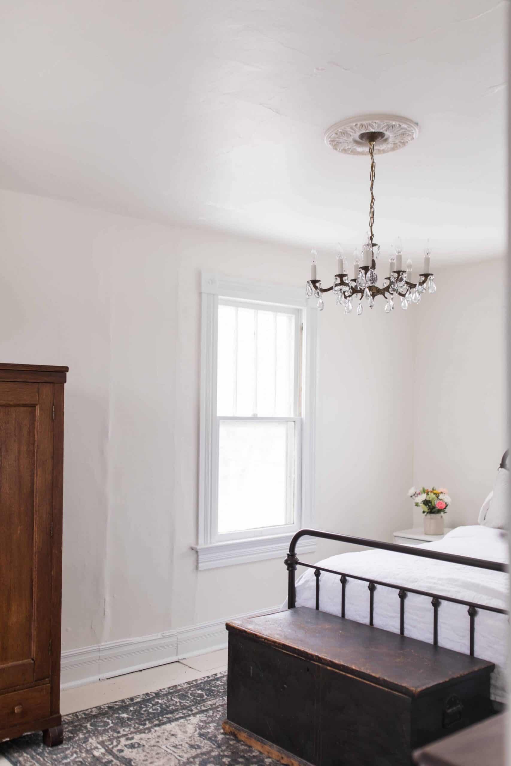 our new chandelier in our farmhouse master bedroom