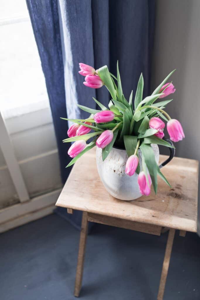 farmhouse mudroom pink tulips wooden antique table