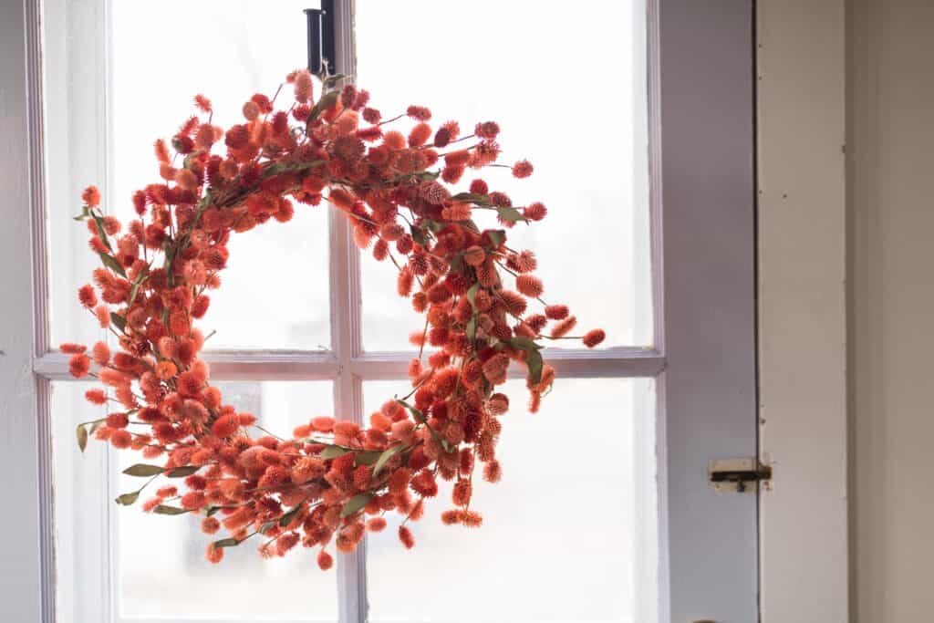 orange wreath farmhouse mudroom