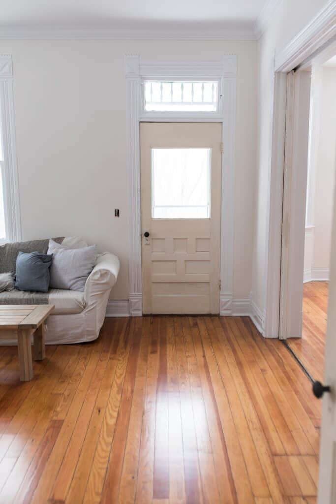 Our new Farmhouse Reveal After Refinishing the Wood Floors and Paint
