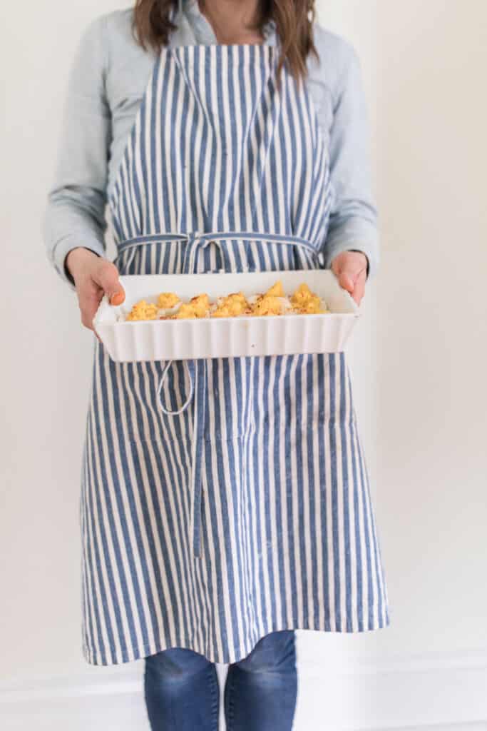 Women holding a platter of the best deviled egg recipes made with homemade mayo