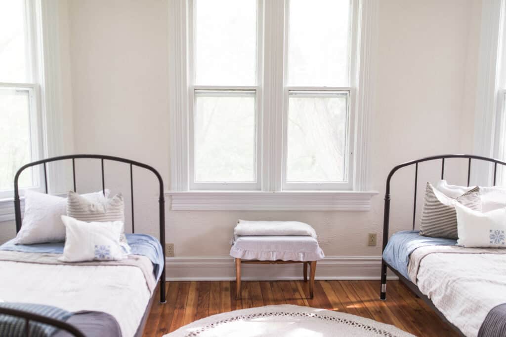 farmhouse boys room iron beds