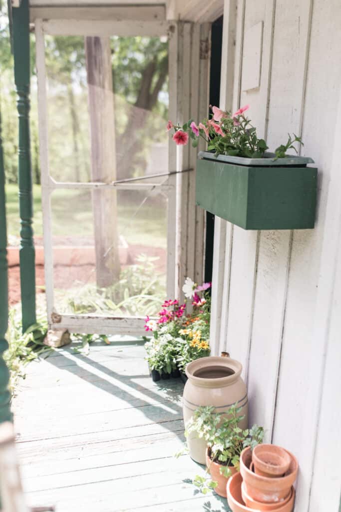 cottage garden farmhouse details crocks petunias cosmos