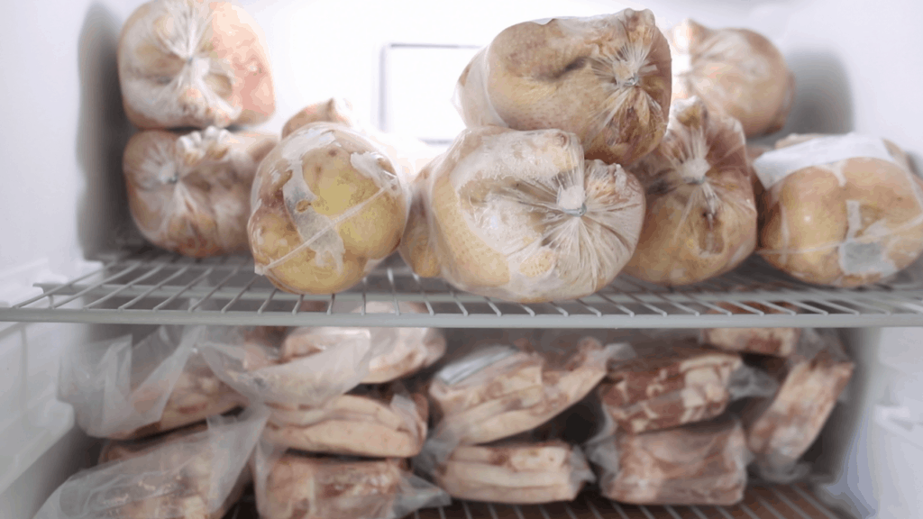 frozen organic chicken and pork in the freezer