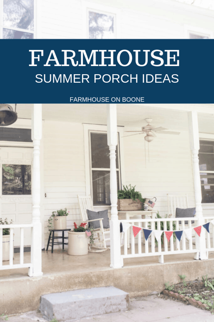 Farmhouse front porch with white furniture, ferns, vintage crocks and crates