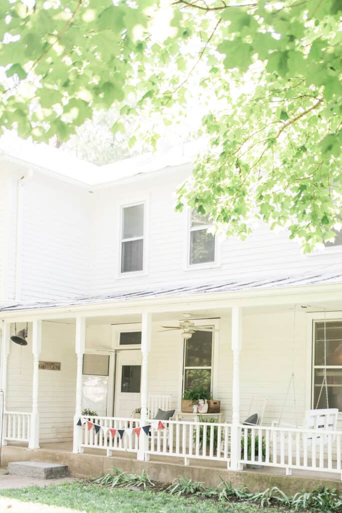 farmhouse front porch decorated for summer