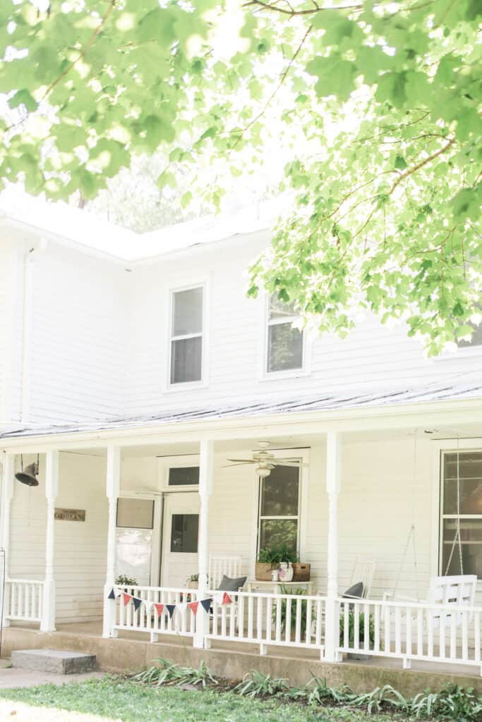 farmhouse front porch decorated for summer