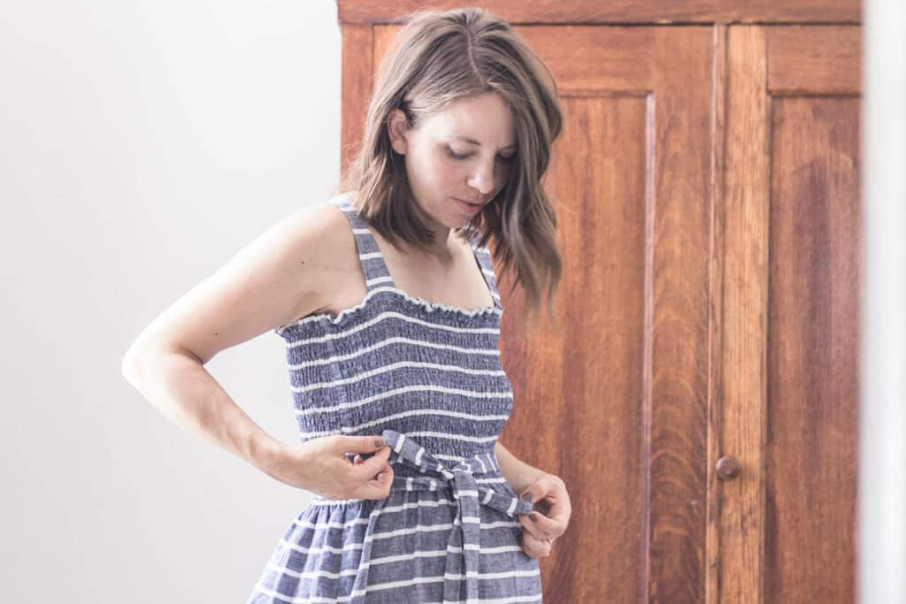 women wearing a blue and white stripped DIY shirred dress