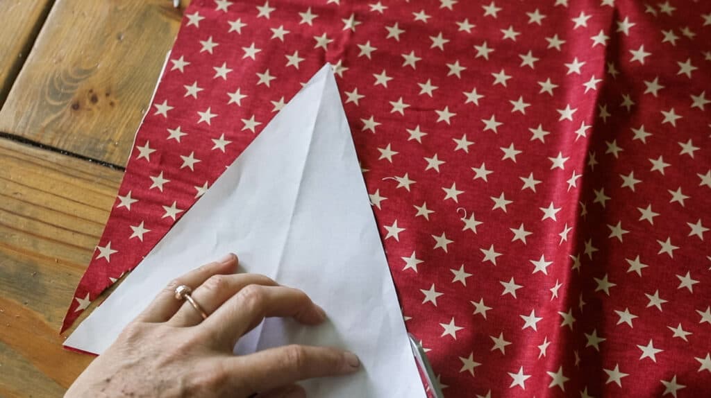 cutting out red stars fabric triangle