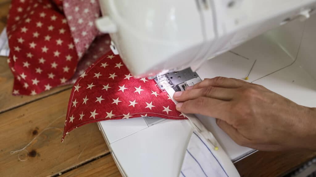 Sewing fabric stars to bais tape for DIY fabric bunting