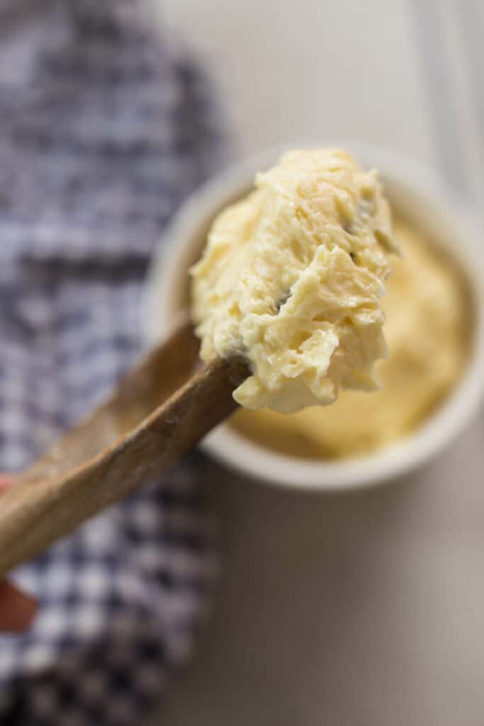 homemade raw milk butter grass fed on a wooden spoon