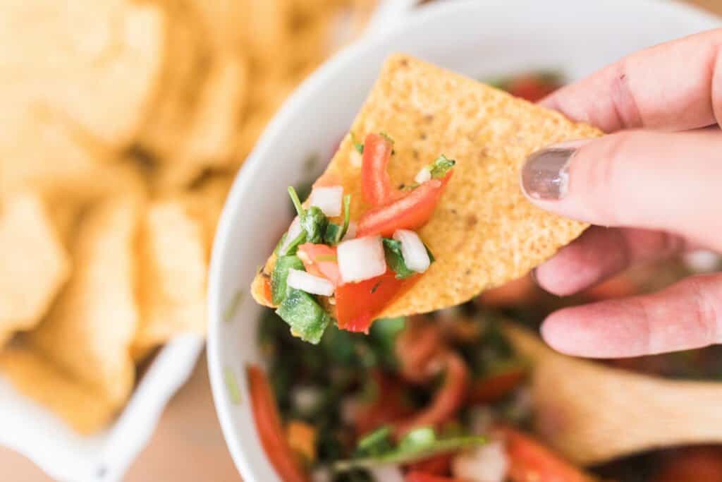 chip with fermented salsa on it