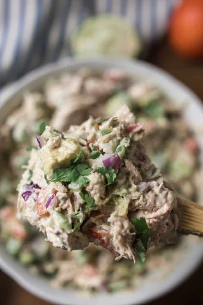 scooping out a serving of southwest chicken salad