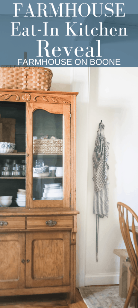 antique hutch with collected dishes and glasses with aprons to the right