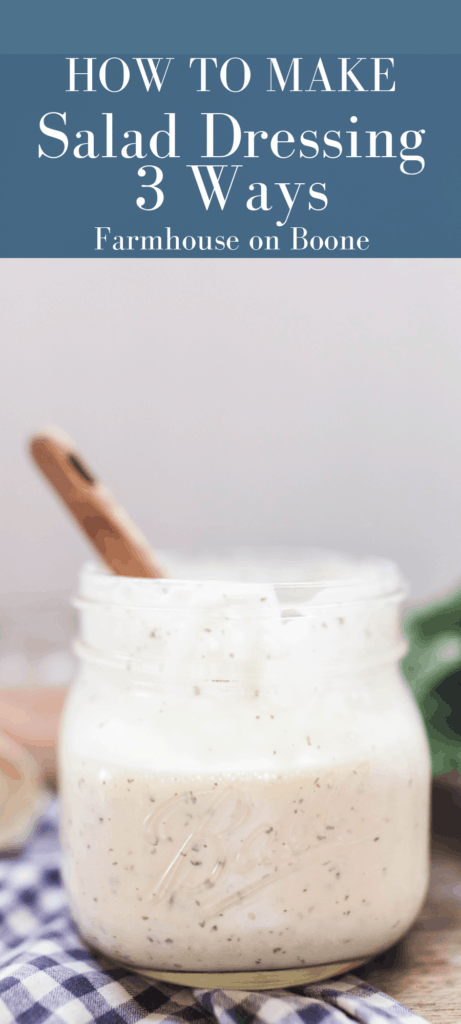 homemade ranch dressing in a mason jar with a wooden spoon in the jar on top a wood table