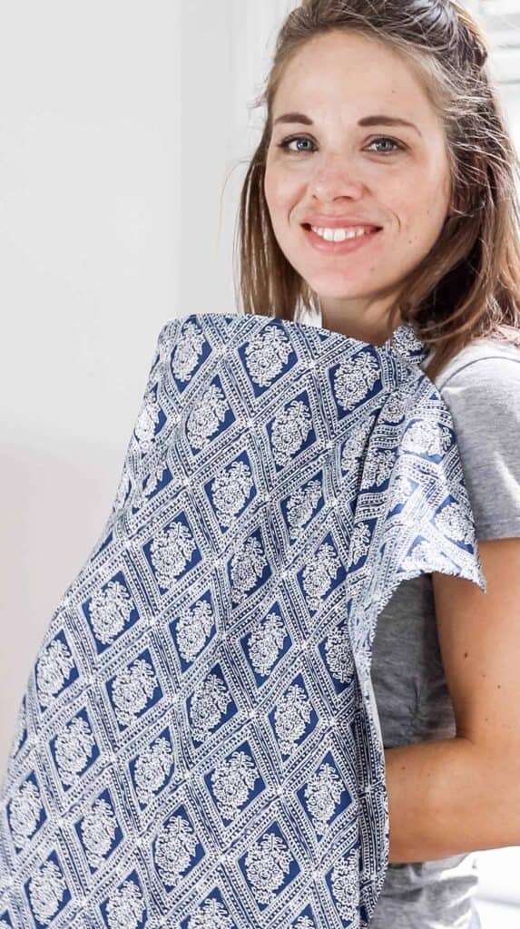 women wearing a blue and white paisley patterned DIY nursing cover