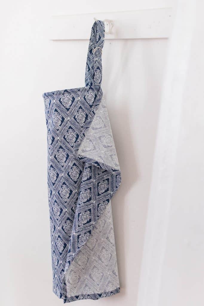 DIY nursing cover hanging on a white wooden coat rack