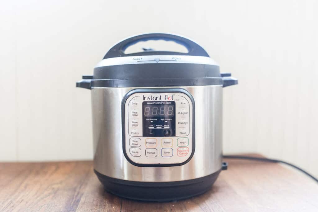 Instant Pot sitting on a wood table