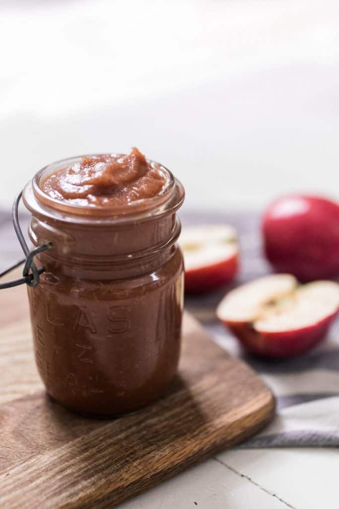 apple butter with apple in background