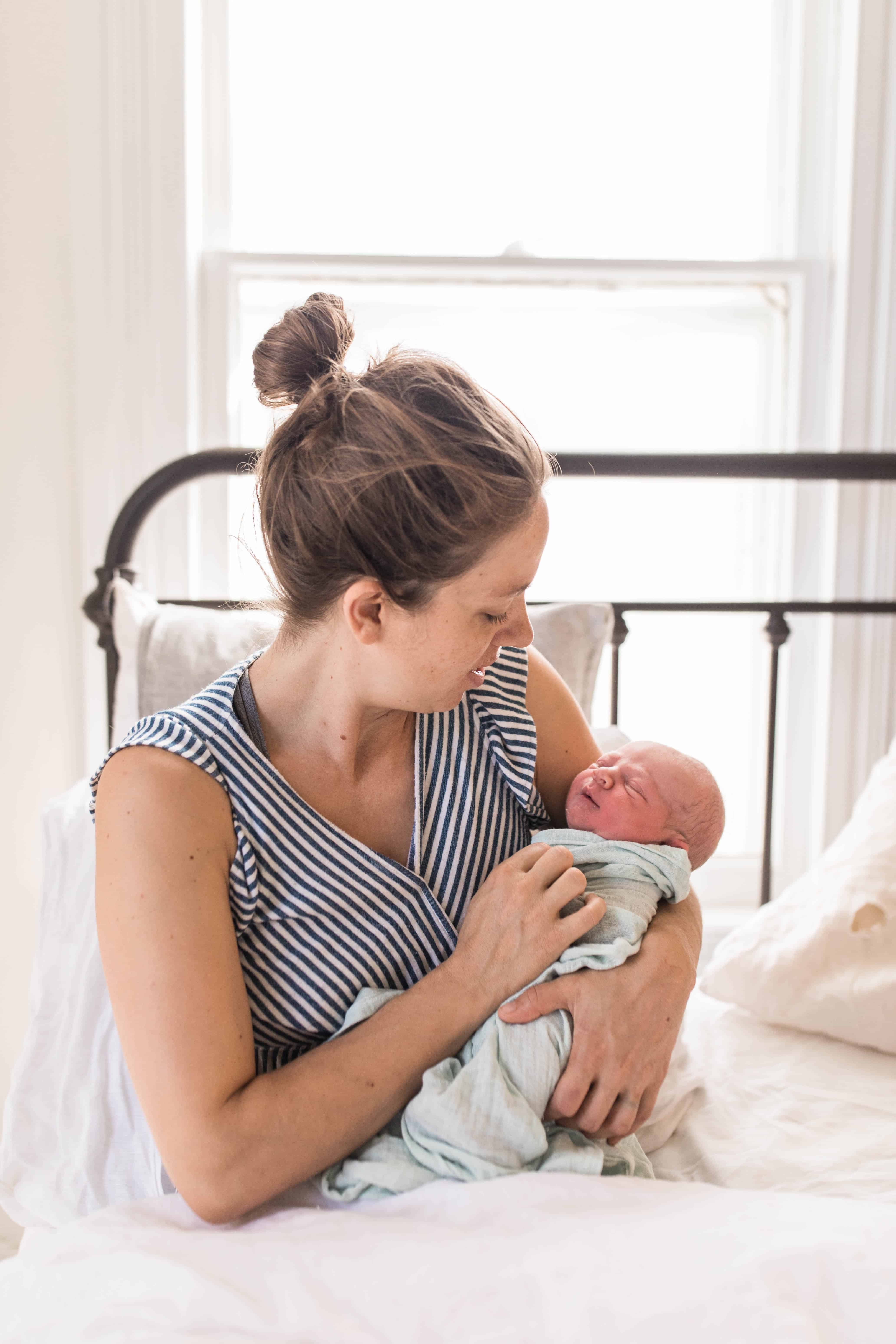 mom in bed with a newborn baby