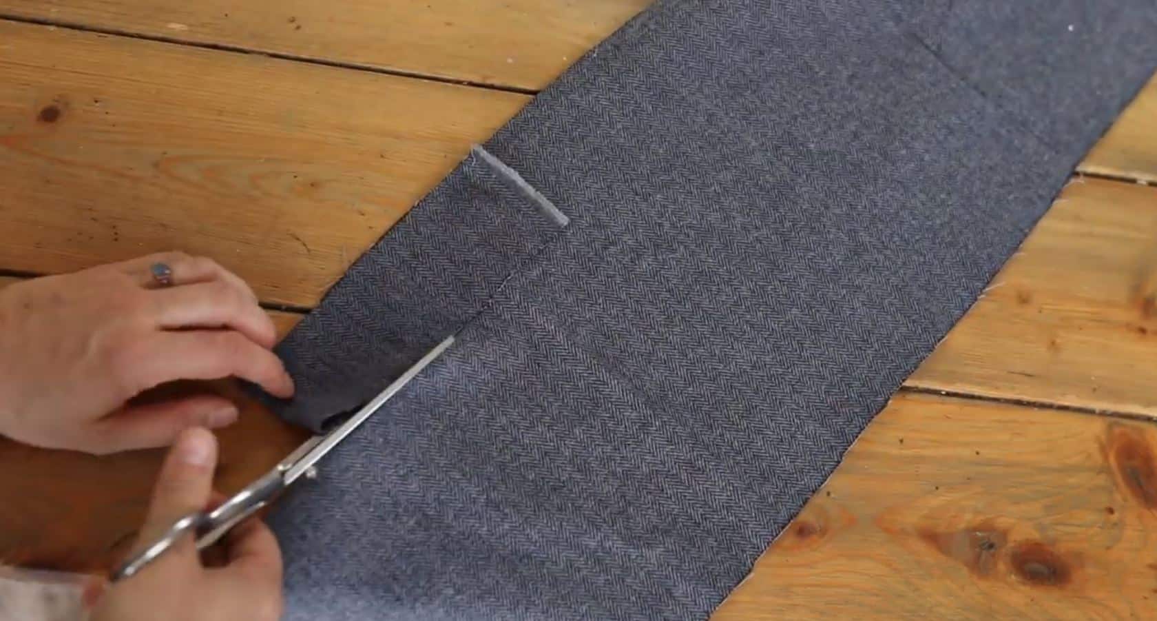 cutting out blue fabric to make piping