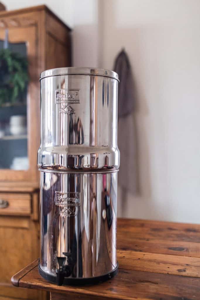 Berkey water filter on a wood farmhouse table