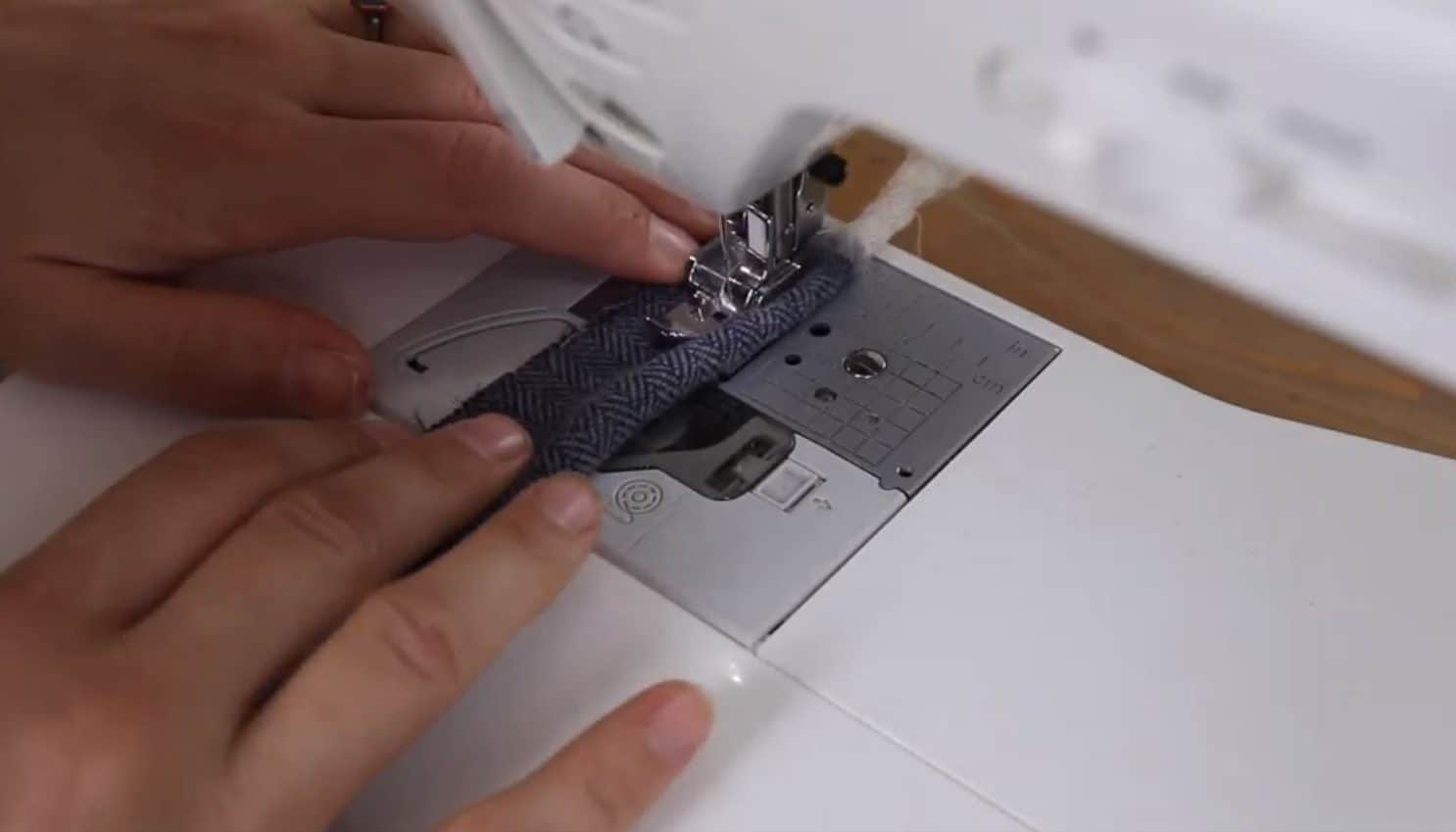 making cording by sewing cotton piping between blue fabric