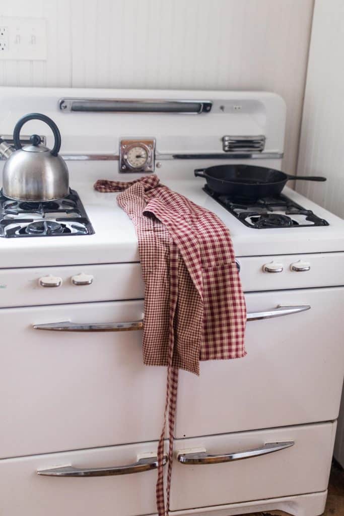 diy reversible apron on a white antique stove