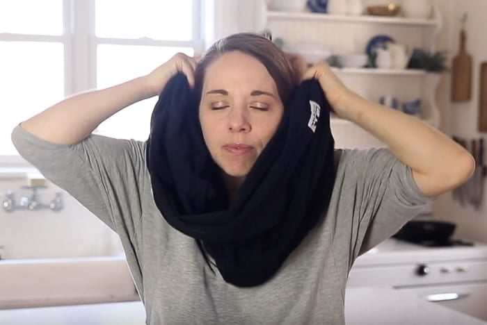 placing the Baby K'tan over head like an affinity scarf